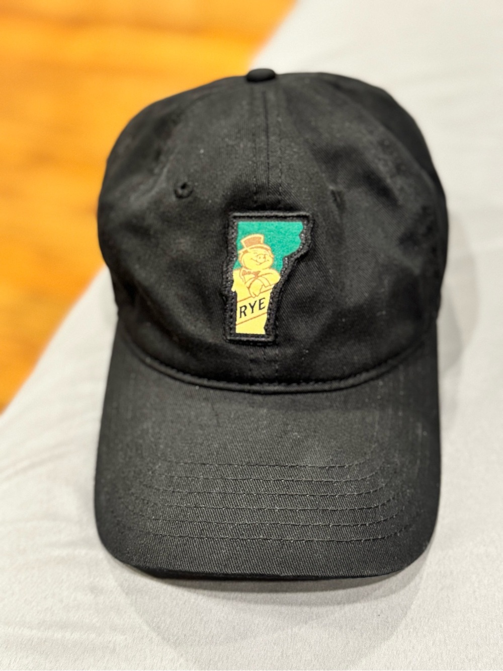 Rye Black Baseball Cap with Yellow & Green Patch